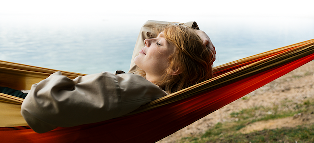 Woman relaxing in a hammock