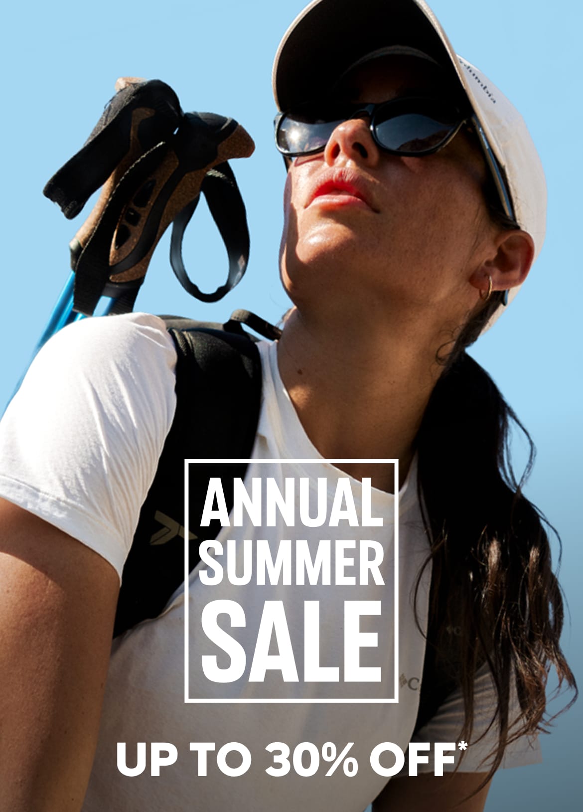 A woman wearing hiking gear against a blue sky with text: Annual Summer Sale Up to 30% Off*