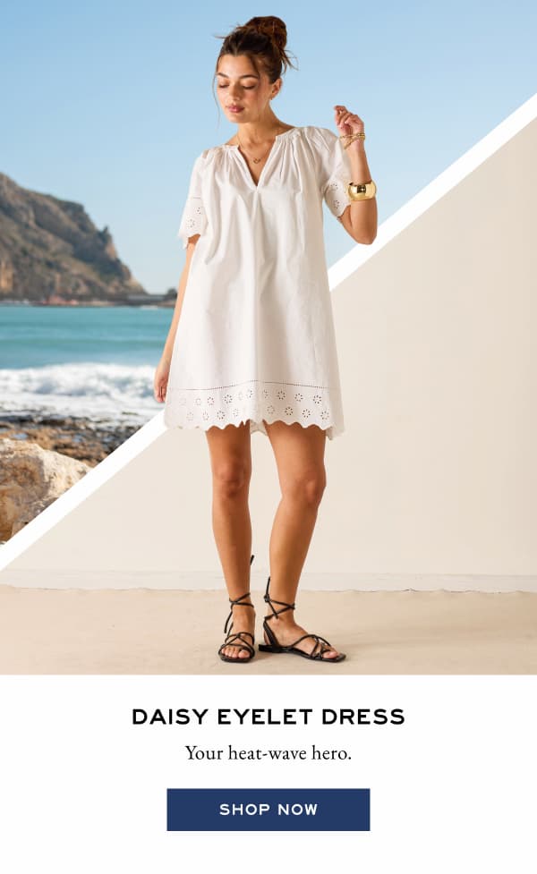 Daisy Eyelet Dress - Your heat-wave hero. - Shop now - Image of a woman wearing a white short sleeve dress that falls above the knee with eyelet details. 