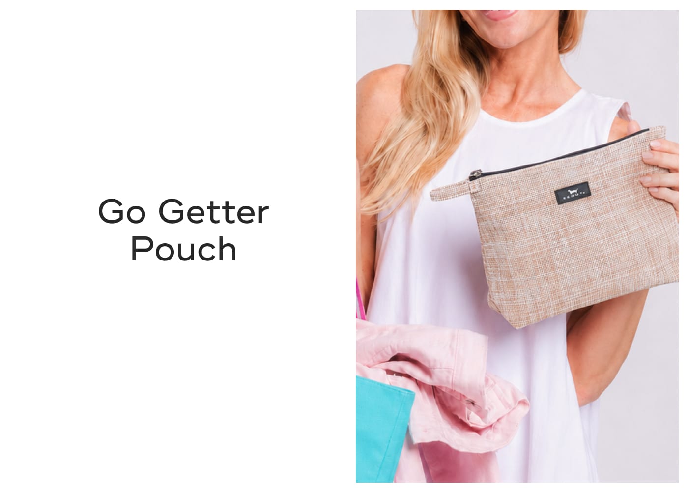 Go Getter Pouch. Woman holding a tan textured pouch.