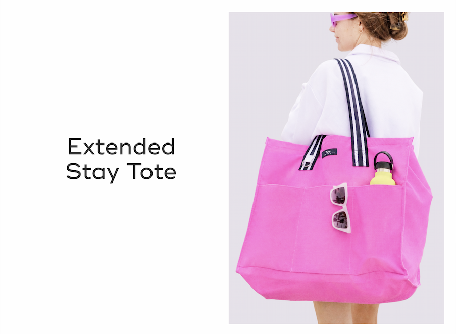 Extended Stay Tote. A person carrying a blue SCOUT Bags tote bag with pockets containing a water bottle and sunglasses.