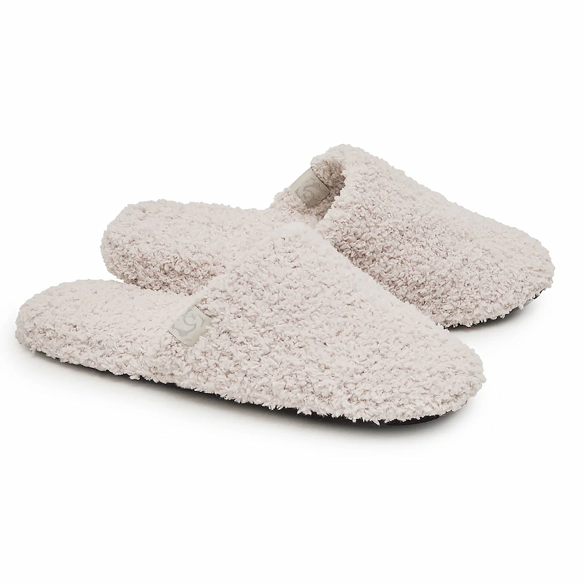 Pair of plush Kashwére closed toe slippers in a soft bone color, shown on a white background.