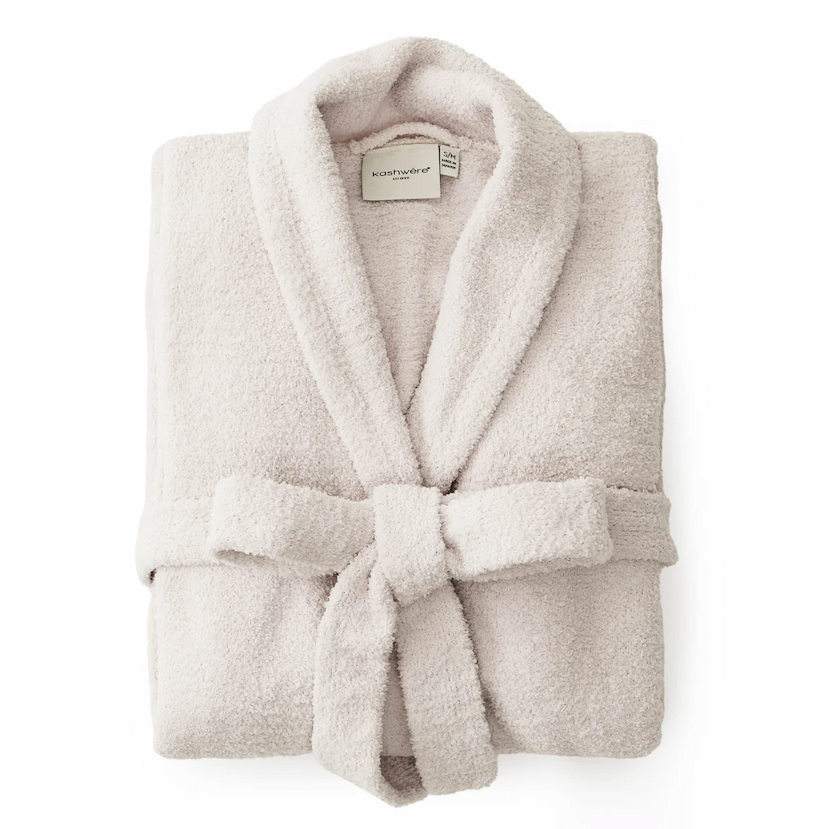 Folded bone-colored Kashwere Seasonless robe with a shawl collar and matching belt, displayed on a white background.