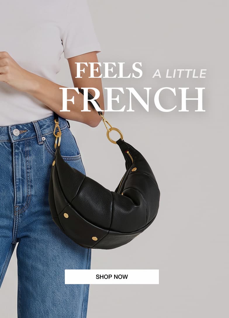 Model wearing the Hammitt Erica Med in Black Pebble leather with the message "Feels a Little French."