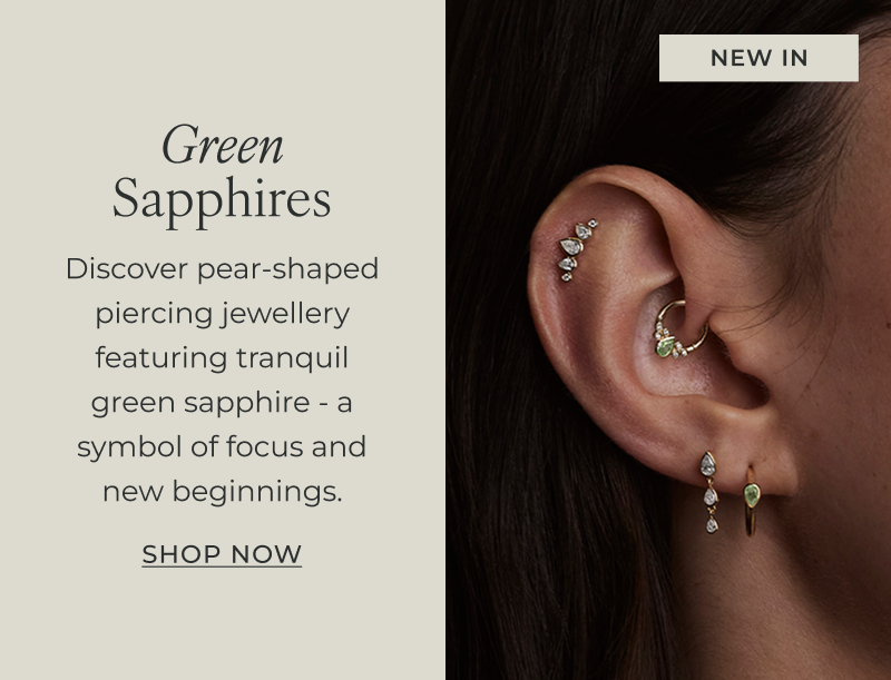 Discover pear-shaped piercing jewellery featuring tranquil green sapphire - a symbol of focus and new beginnings.