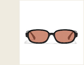 Image of wide round brown sunglasses with apricot lenses