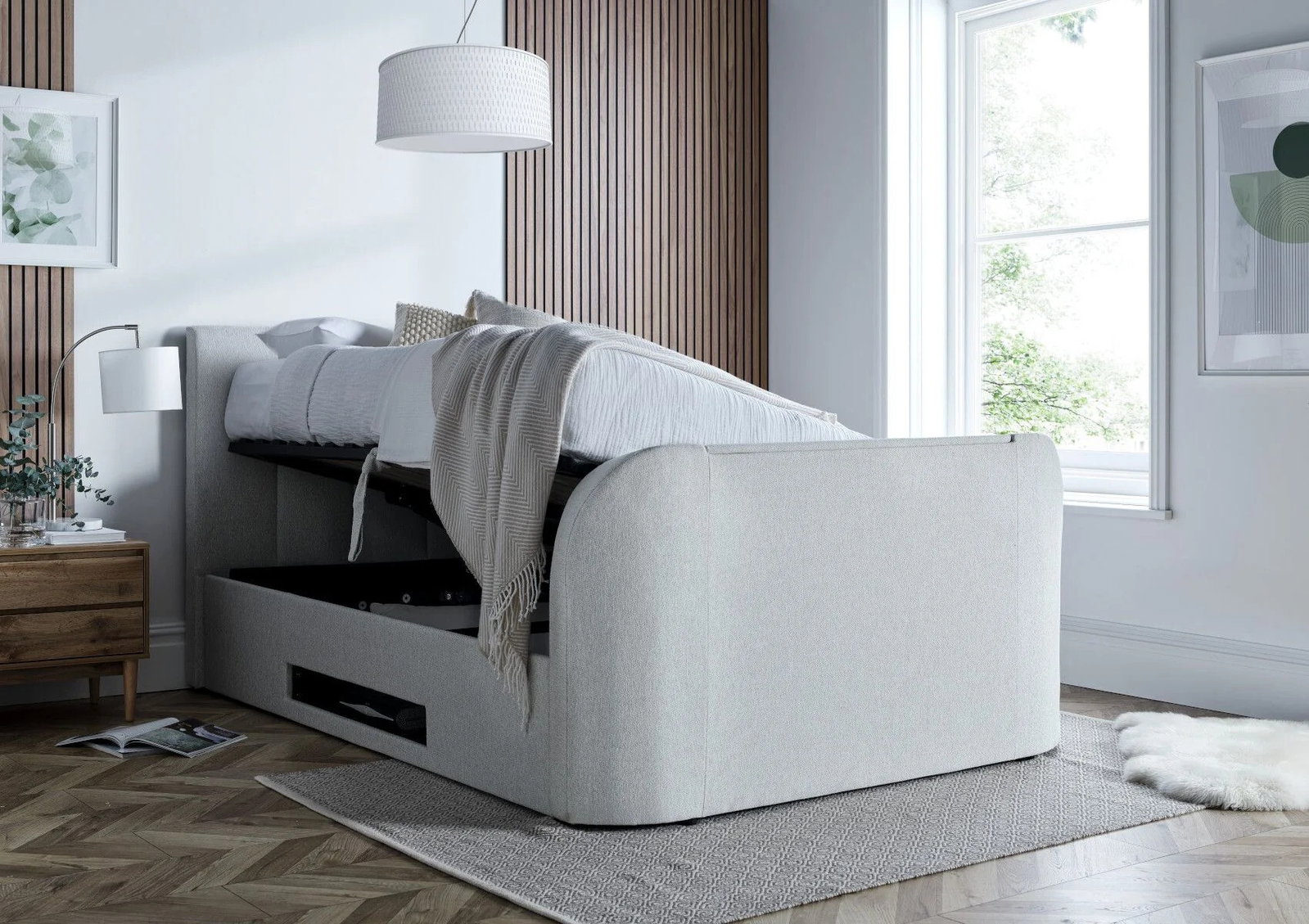 A white fabric ottoman bed, opening.