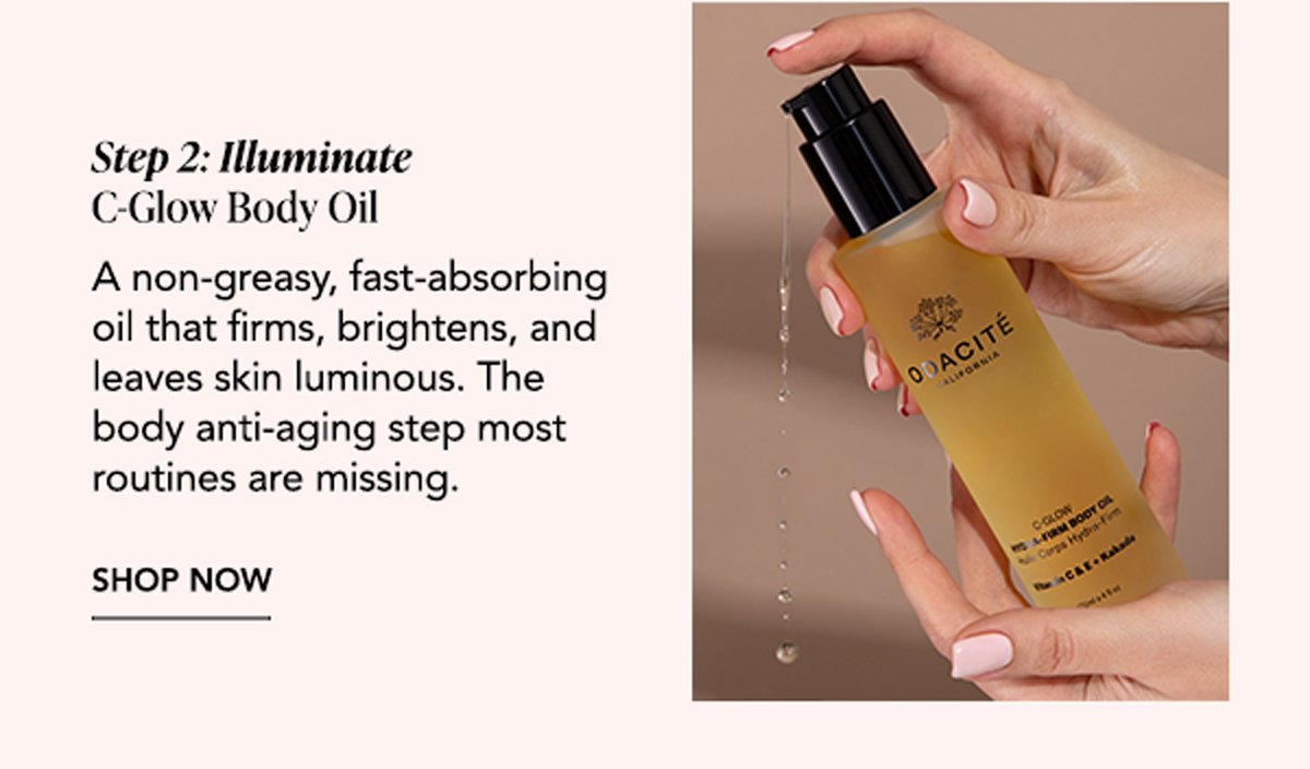 Hands dispensing C-Glow Body Oil from a pump bottle, a fast-absorbing Vitamin C oil designed to firm, brighten, and illuminate the skin.