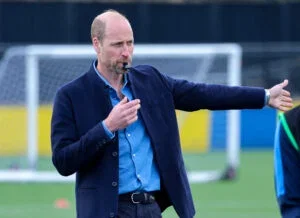 Prince William, Prince of Wales blows the referee's whistle during a mini football game on official visit to an FA Referee Training Course At Sporting Khalsa FC at Aspray Arena on March 11, 2025 in Willenhall, England.