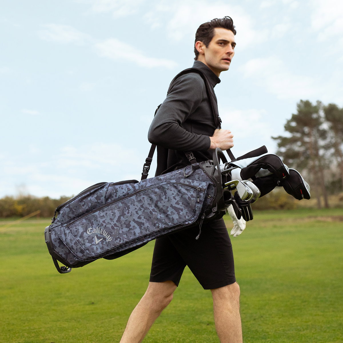 Man carrying Golf Bag