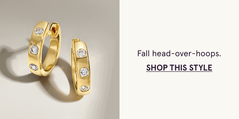 Thick gold huggies with round diamonds flush-set.  Head-over-hoops. Click here to shop this style