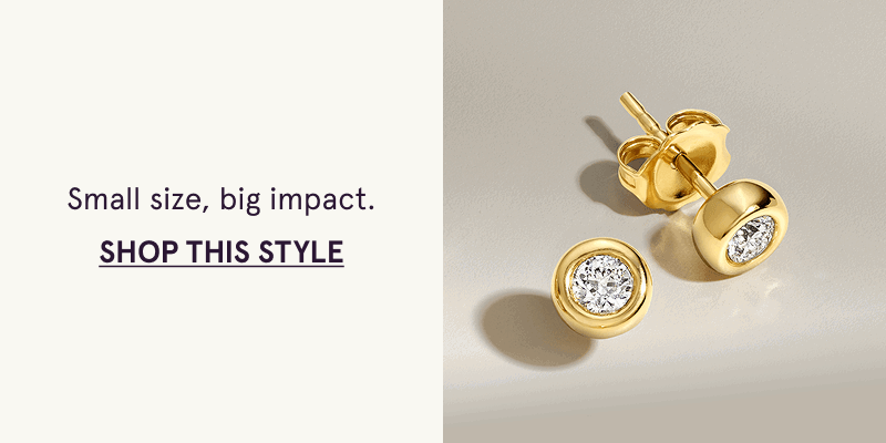 Round gold studs with diamonds enclosed.  Small size, big impact. Click here to shop this style