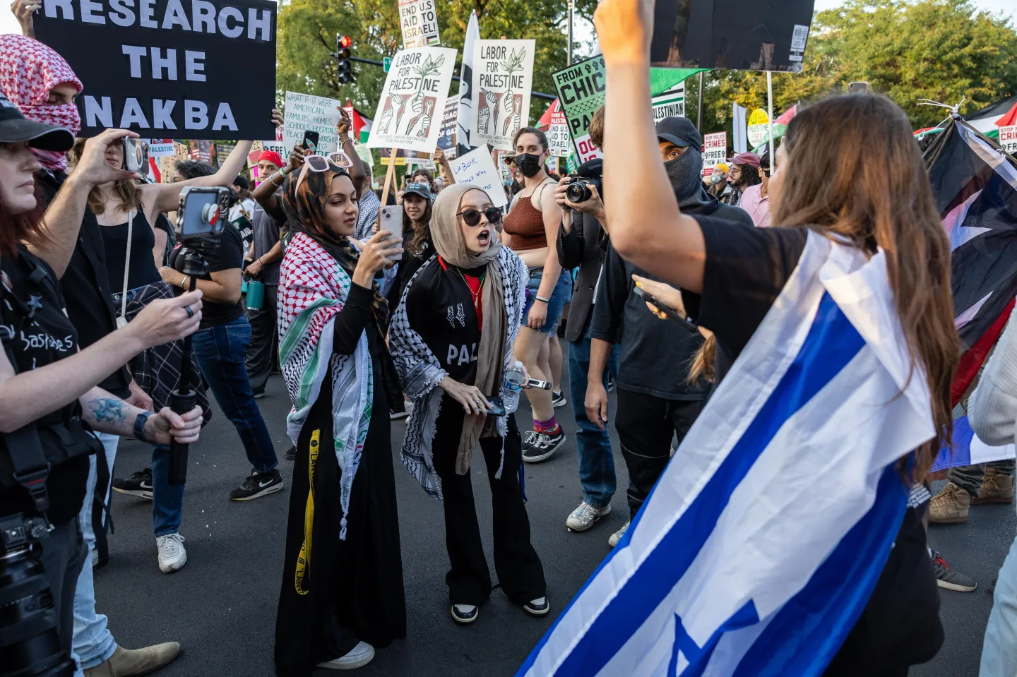 Pro-Palestinian demonstrators argue with Israel supporters outside of the Democratic National Convention on August 22, 2024, in Chicago, Illinois. John Moore/Getty