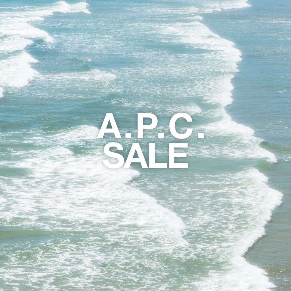 A.P.C. Sale - waves crashing along a beach shore