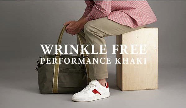 Man poses in Wrinkle Free Performance Khaki. Text says, "Wrinkly Free Performance Khaki".