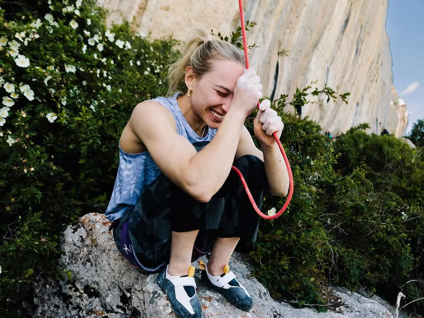 women holding climbing rope excitedly