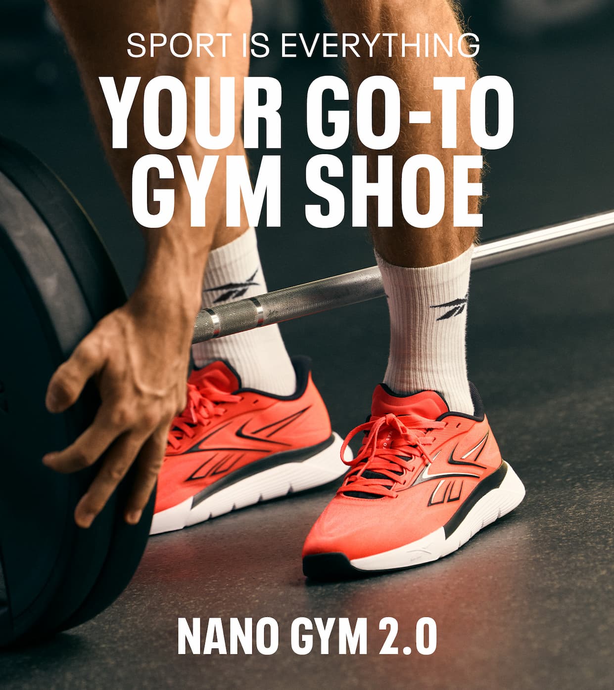 Close-up of a person lifting a barbell while wearing bright Nano Gym 2.0 training shoes. Text reads: “SPORT IS EVERYTHING. YOUR GO-TO GYM SHOE. NANO GYM 2.0.”