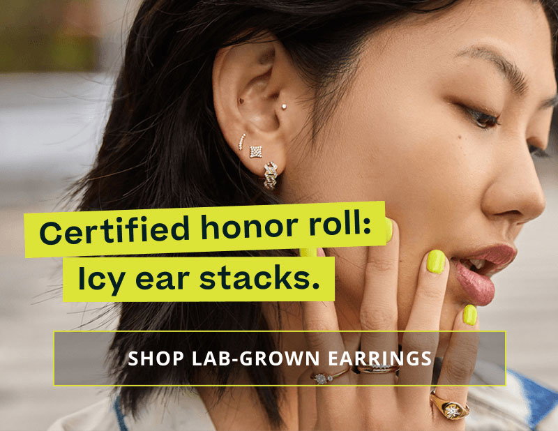 Model with geometrical gold-set studs & huggie set with diamonds. Certified: Icy ear stacks. Click here to shop lab-grown diamonds