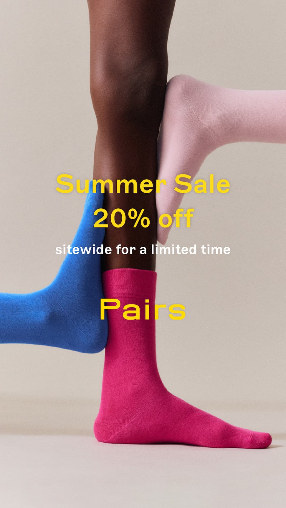 Model wearing blue and pink socks