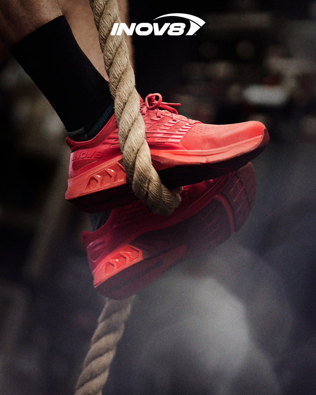 A pair of F-LITE MAX trainers gripping onto rope to help an athlete climb