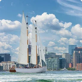 Tall ship masts against a blue sky.