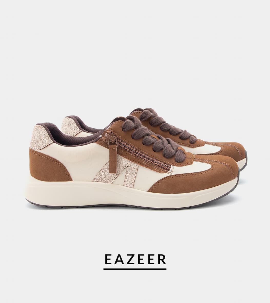 Side view of the Alegria Eazeer lace-up sneaker in cream and brown with metallic accent panels, a side zipper, chunky laces, and a power walker slip resistant outsole.