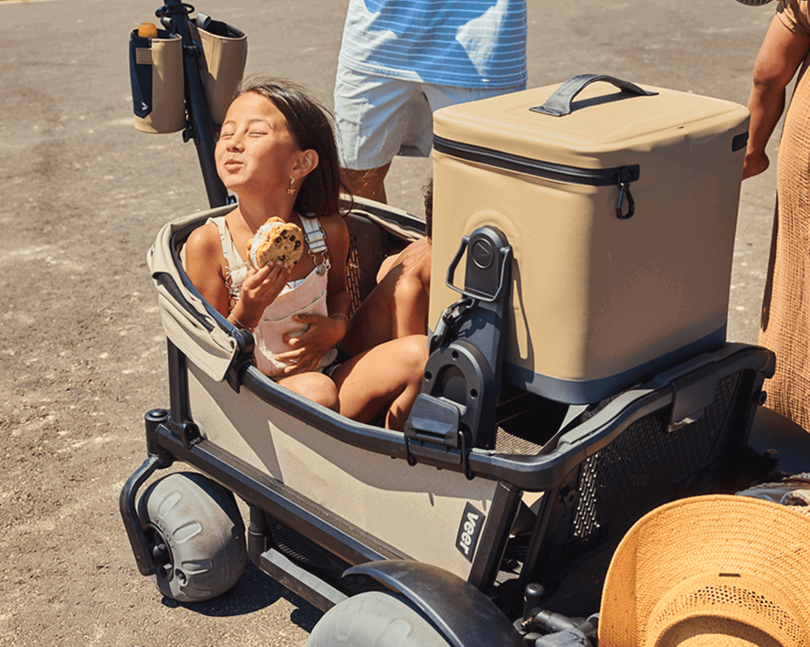 Child riding in a Cruiser with a Day Cooler