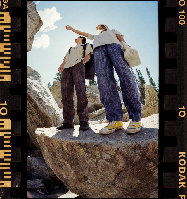 Two climbers standing on a rock in Rockrydge™ Pants