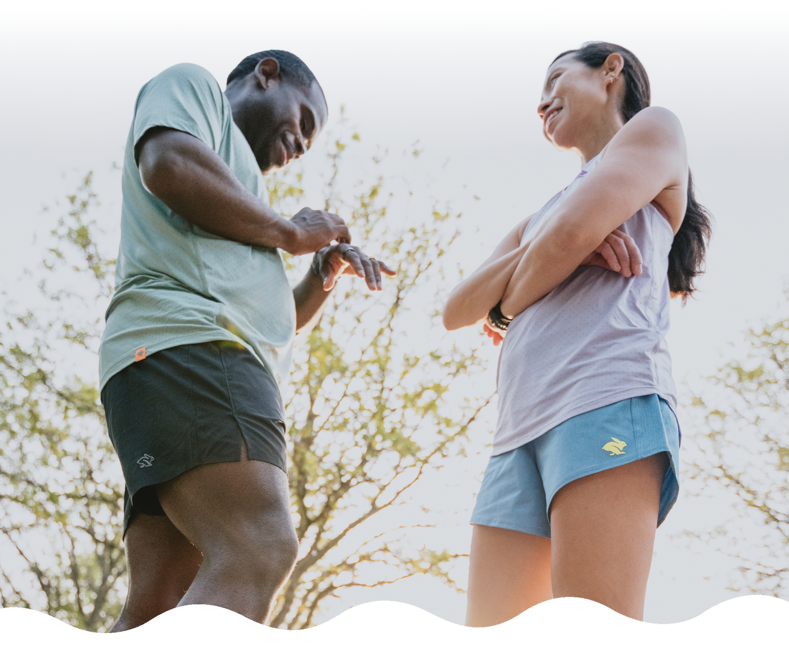 Man and woman preparing for a run