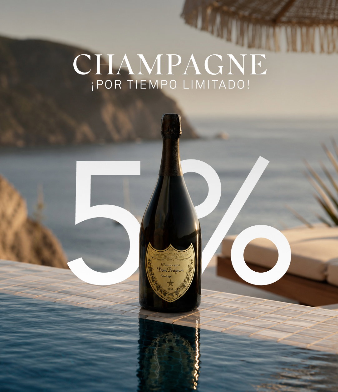 Bottle of champagne on a tiled infinity pool edge with sea cliffs and sun umbrella in the background, promotional 5% overlay
