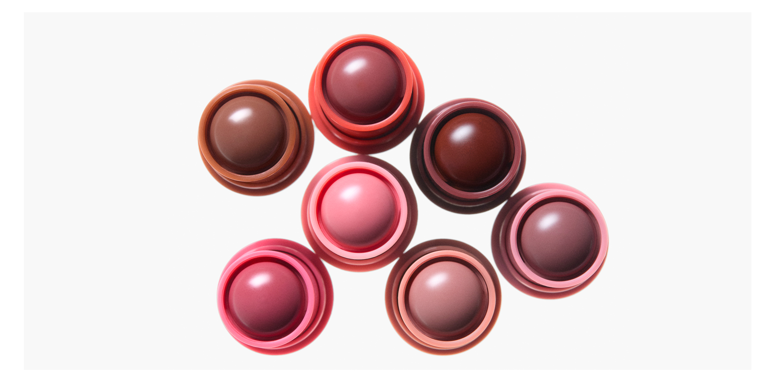 an image of the different shades of Haus Labs glassy blush balm, seen in a top-down view of the balm tube