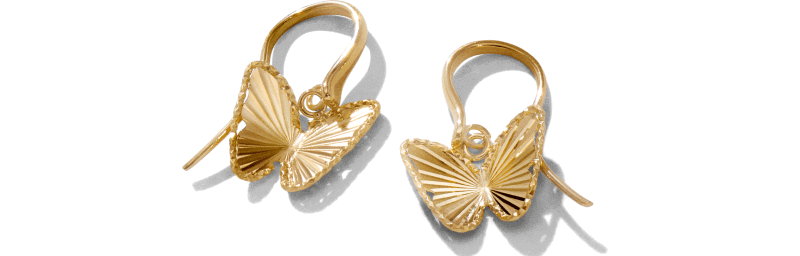 Pair of yellow gold butterfly drop earrings with textured wings.
