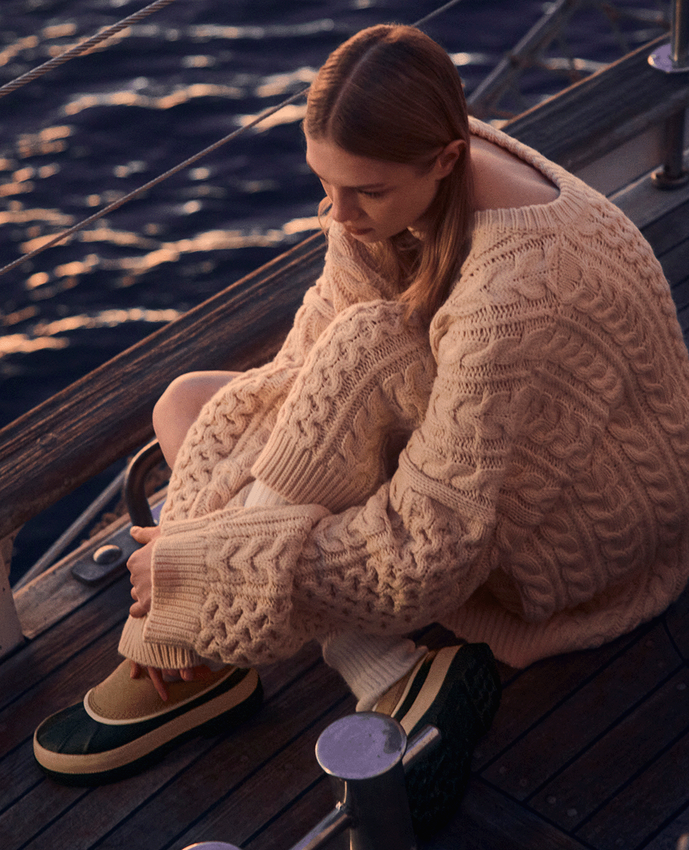 Woman wearing Ambler™ Waterproof Clog on boat