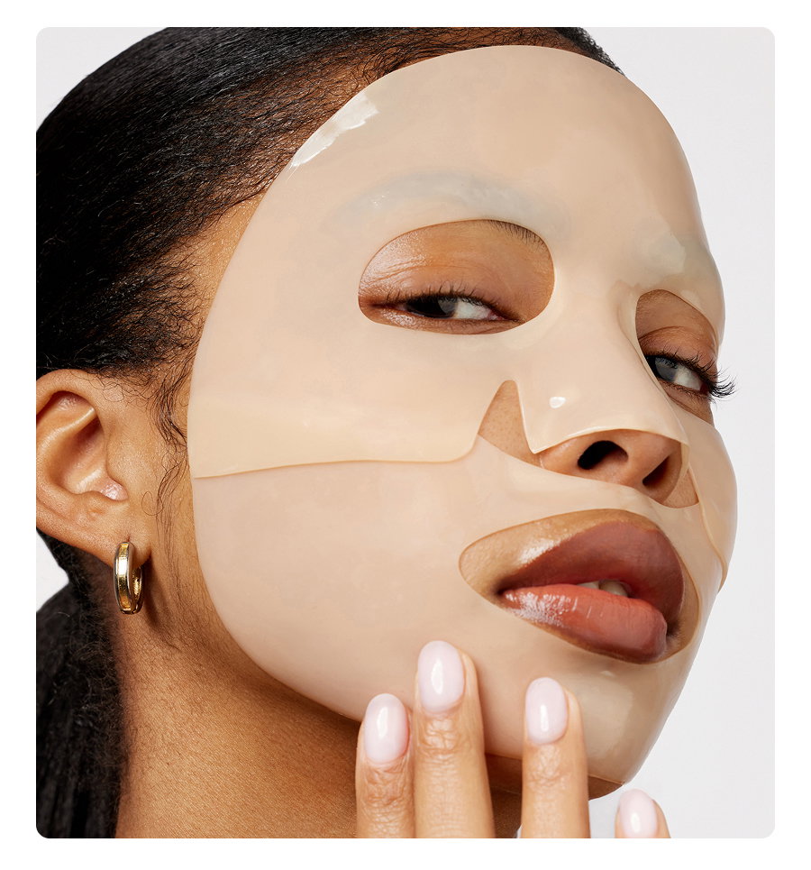A woman wears her Overnight Recovery Mask