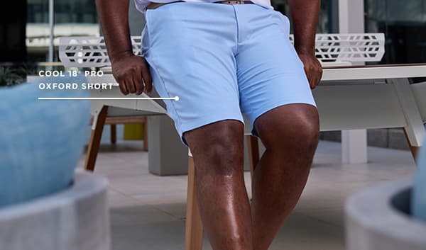 Man poses in the Cool 18 Pro Oxford short