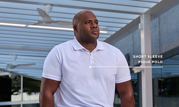 Man poses in the short sleeve pique polo