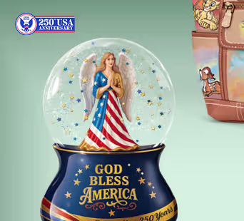 Display this guardian angel musical glitter globe that honors 250 years of the USA