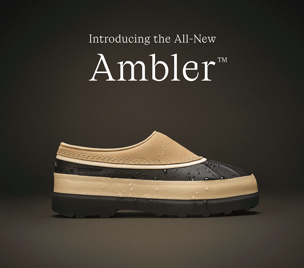 Introducing the All-New Ambler™ - photo of Ambler™ Waterproof Clog with water drops on shoe.