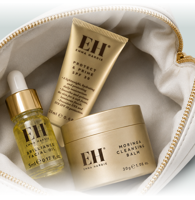 Emma Hardie Protect & prime, Brilliance Facial Oil and Moringa Cleansing Balm mini trio in a white handbag