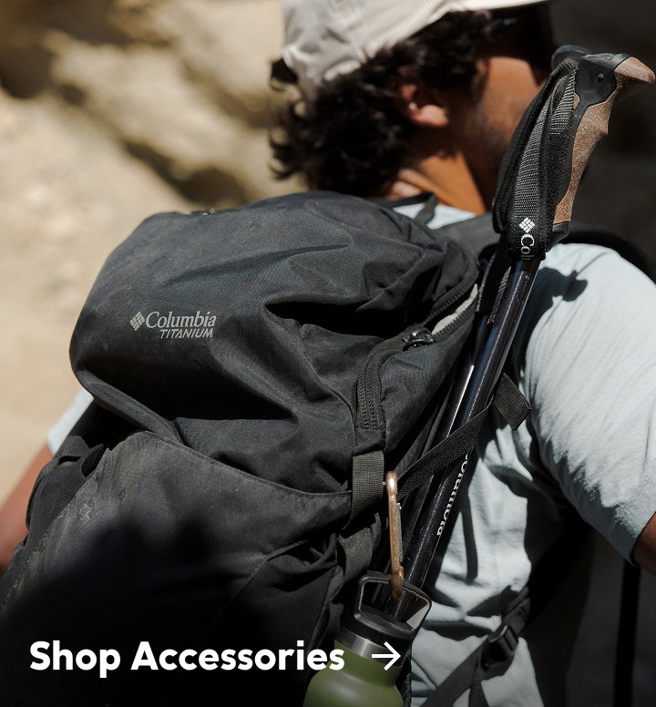 Close-up of a man's black hiking backpack with text: Shop Accessories