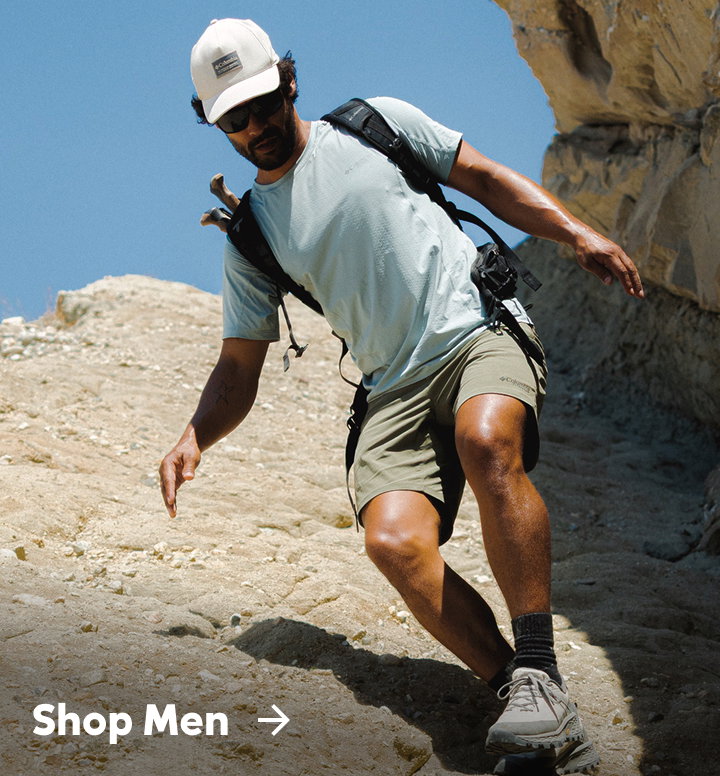 A man hiking in a rocky landscape with text: Shop Men