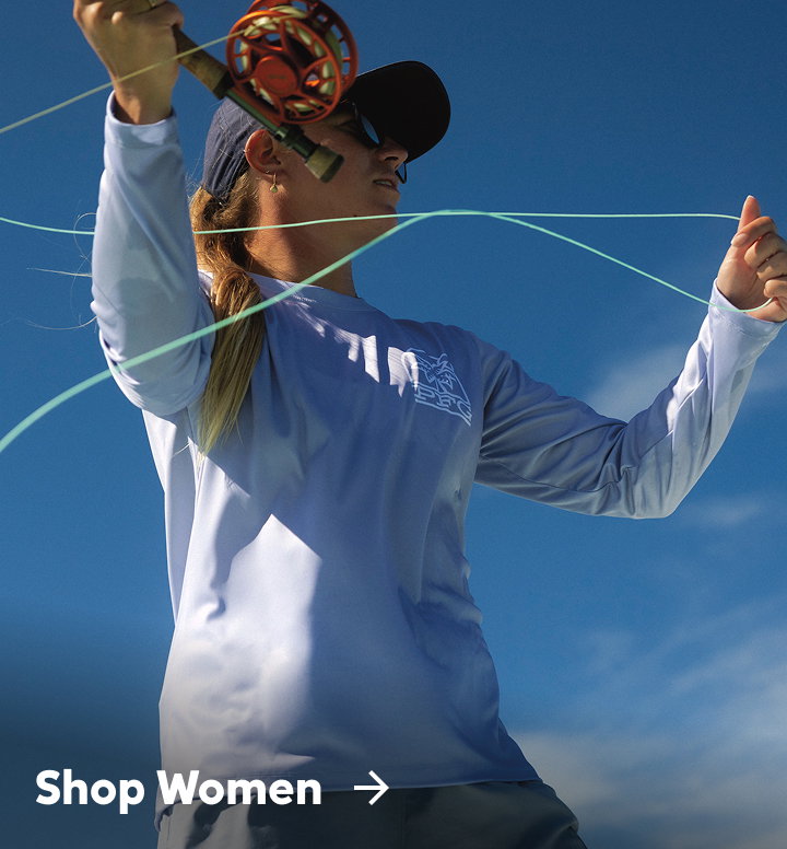 A woman holding a fishing rod against a blue sky with text: Shop Women