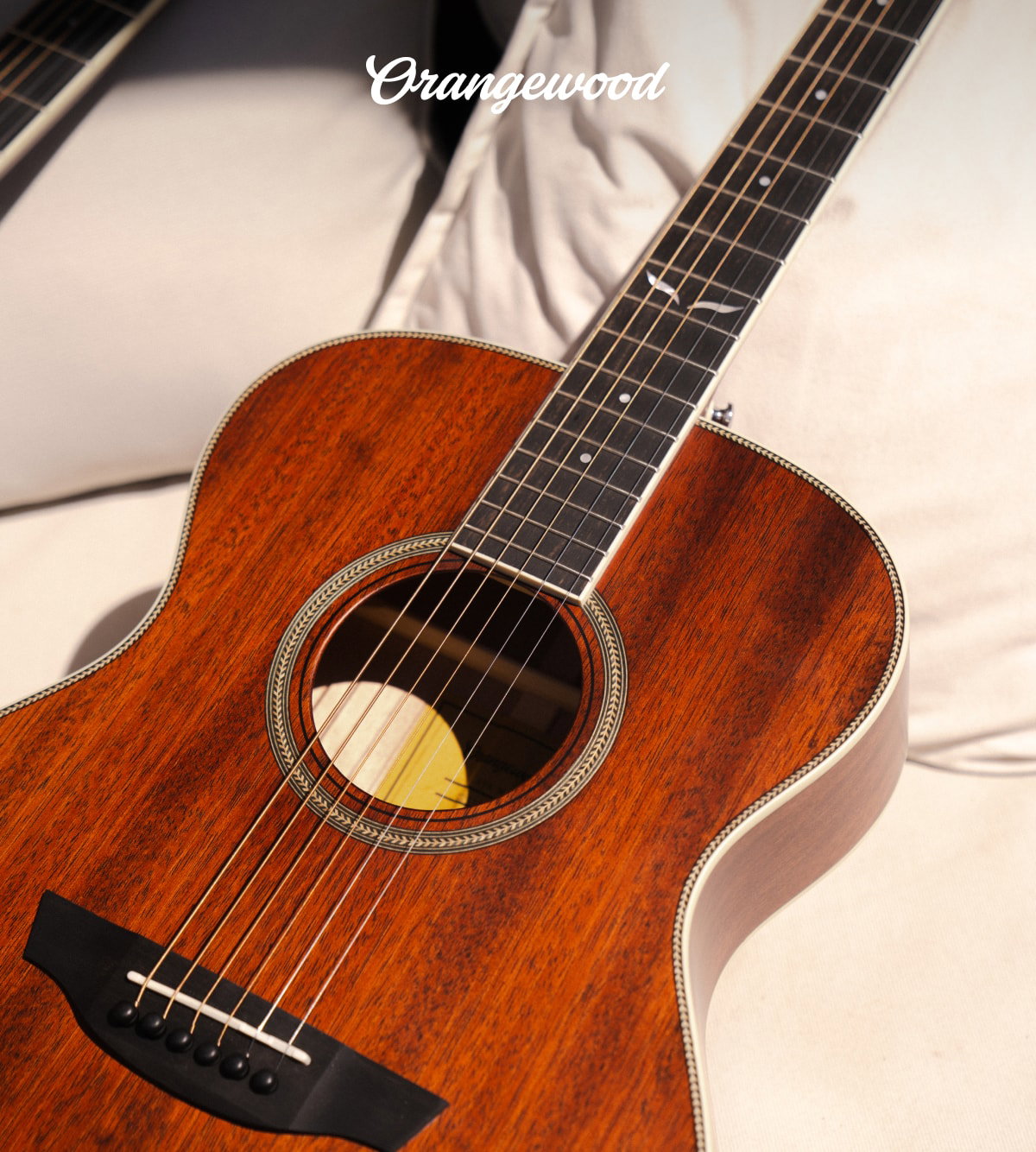 Orangewood Logo | closeup of ava mahogany