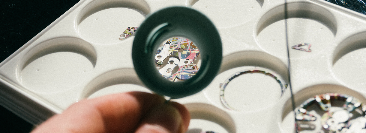 CW Logo Made From Paint Bottle Caps