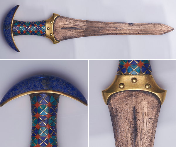 An ancient Egyptian dagger embellished with gold and lapis lazuli.