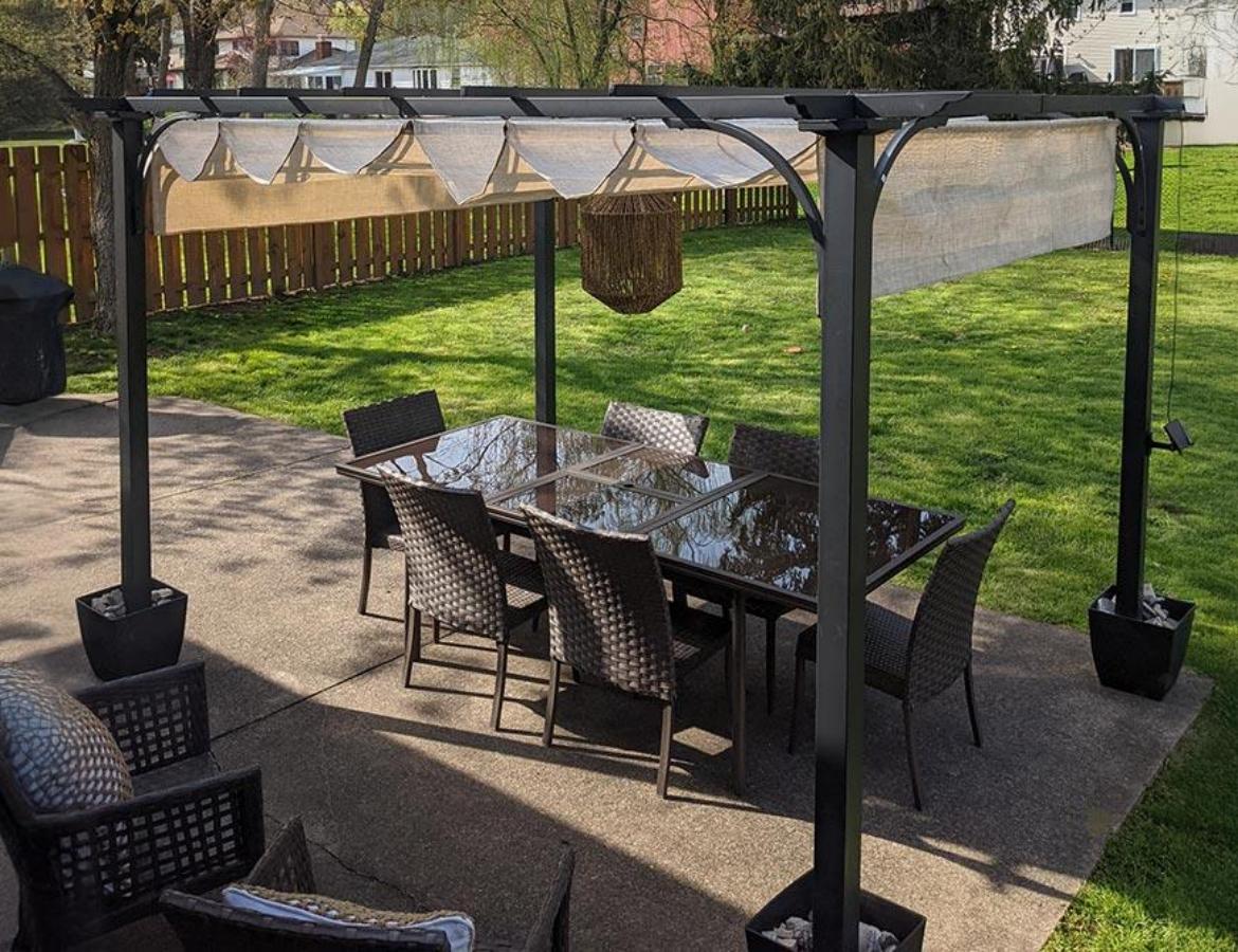 sunjoy pergola in backyard
