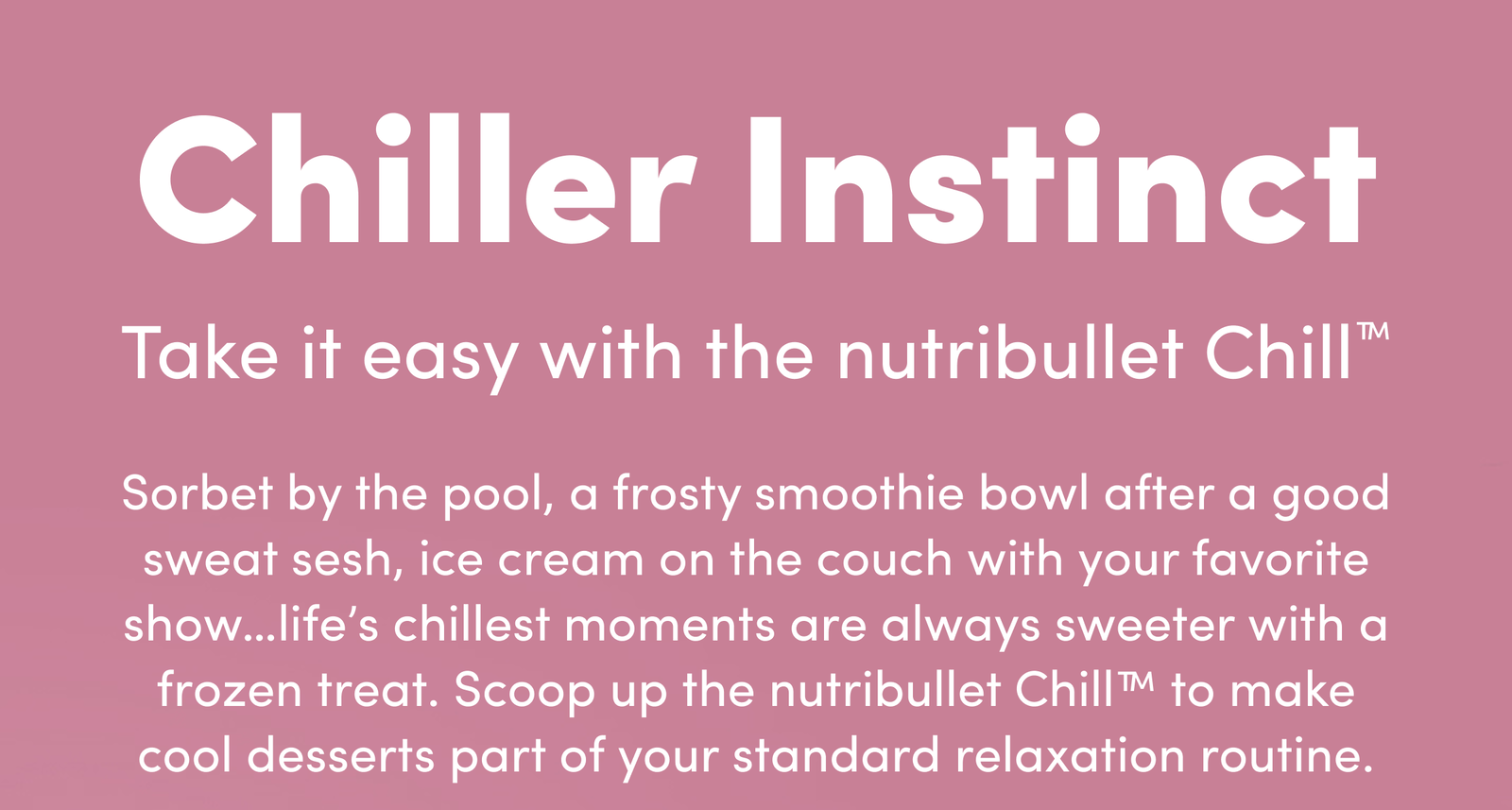 A white nutribullet Chill™ Ice Cream Maker beside a pink ceramic bowl and a waffle cone stacked with strawberry scoops.
