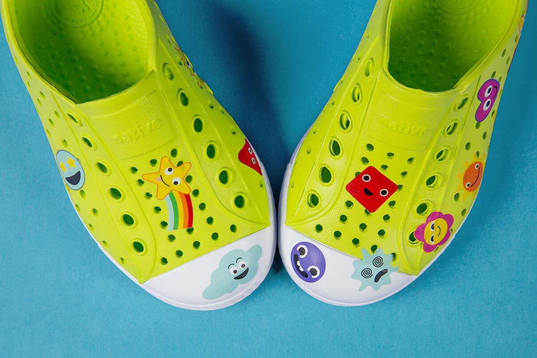 a pair of native shoes with expressions dekkos