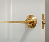 Close up of gold lever handle