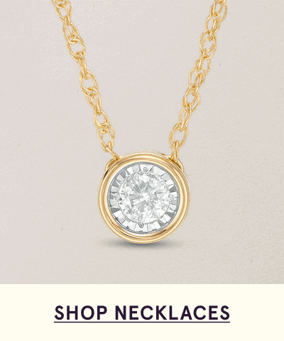 Gold twist chain with round encrusted diamond pendant.  Click here to shop necklaces